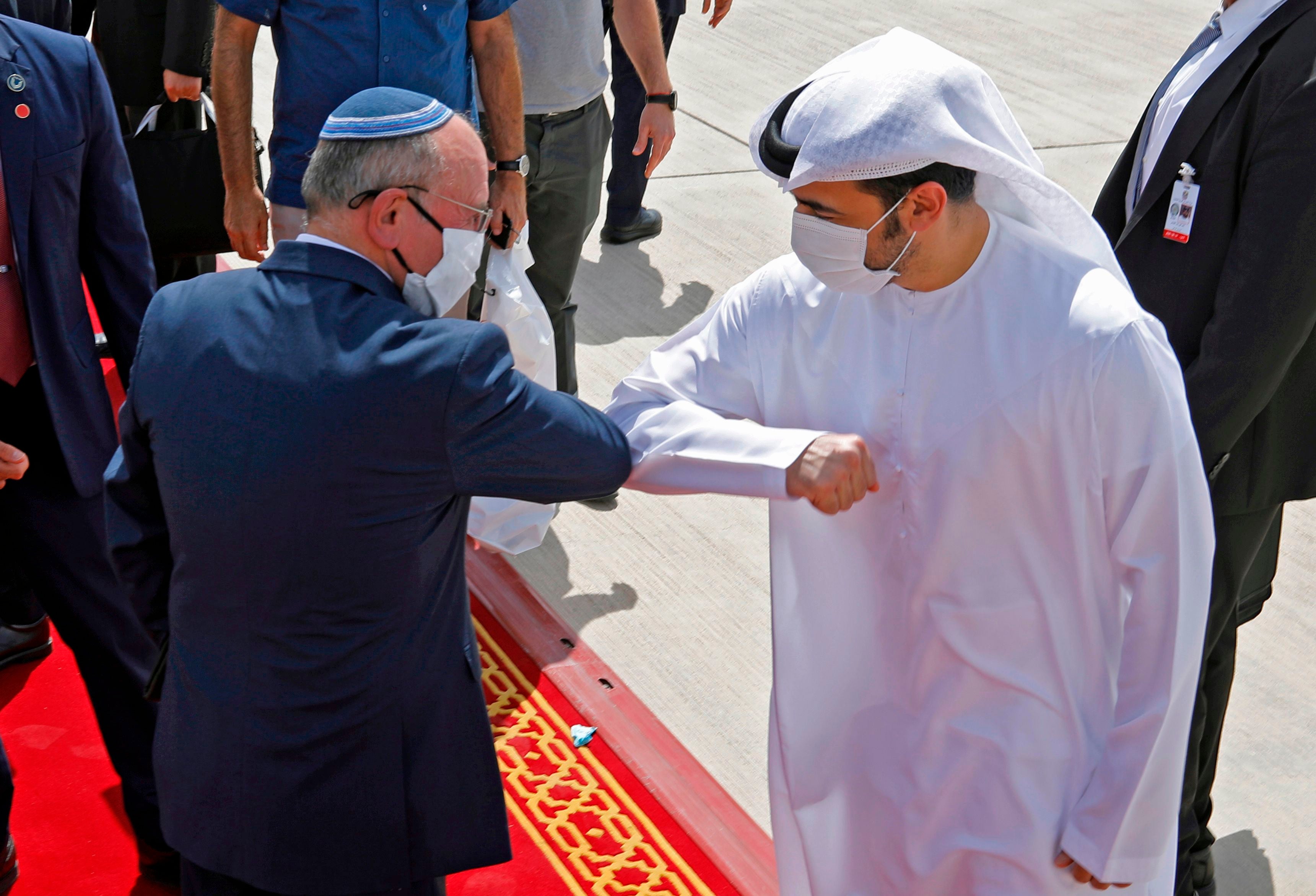 Israeli and Emirati officials greet ahead of their trip to the UAE