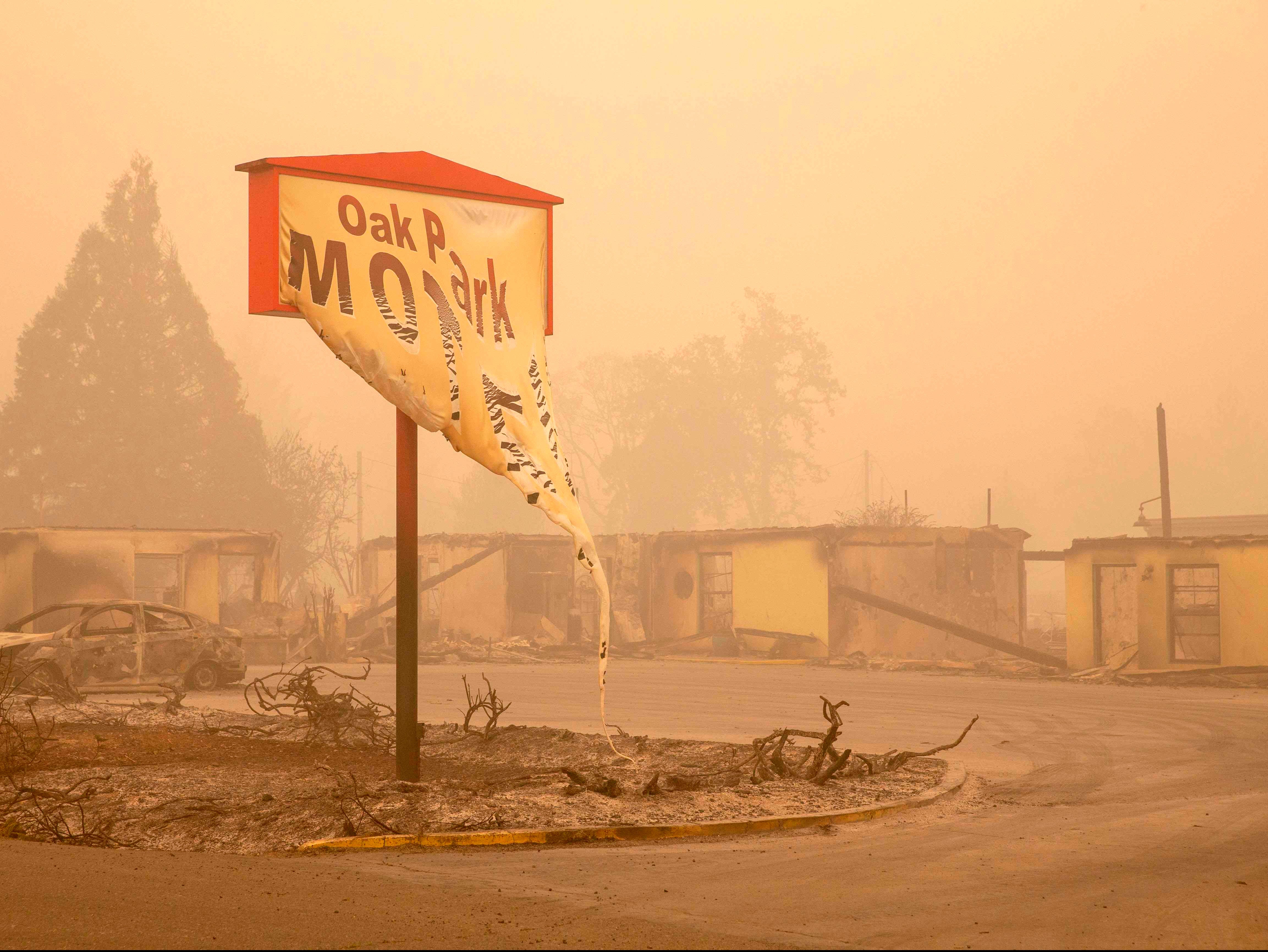 The melted sign of the Oak Park Motel destroyed by the flames of the Beachie Creek Fire is seen in Gates, east of Salem, Oregon