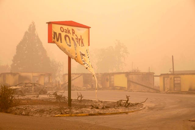The melted sign of the Oak Park Motel destroyed by the flames of the Beachie Creek Fire is seen in Gates, Oregon 