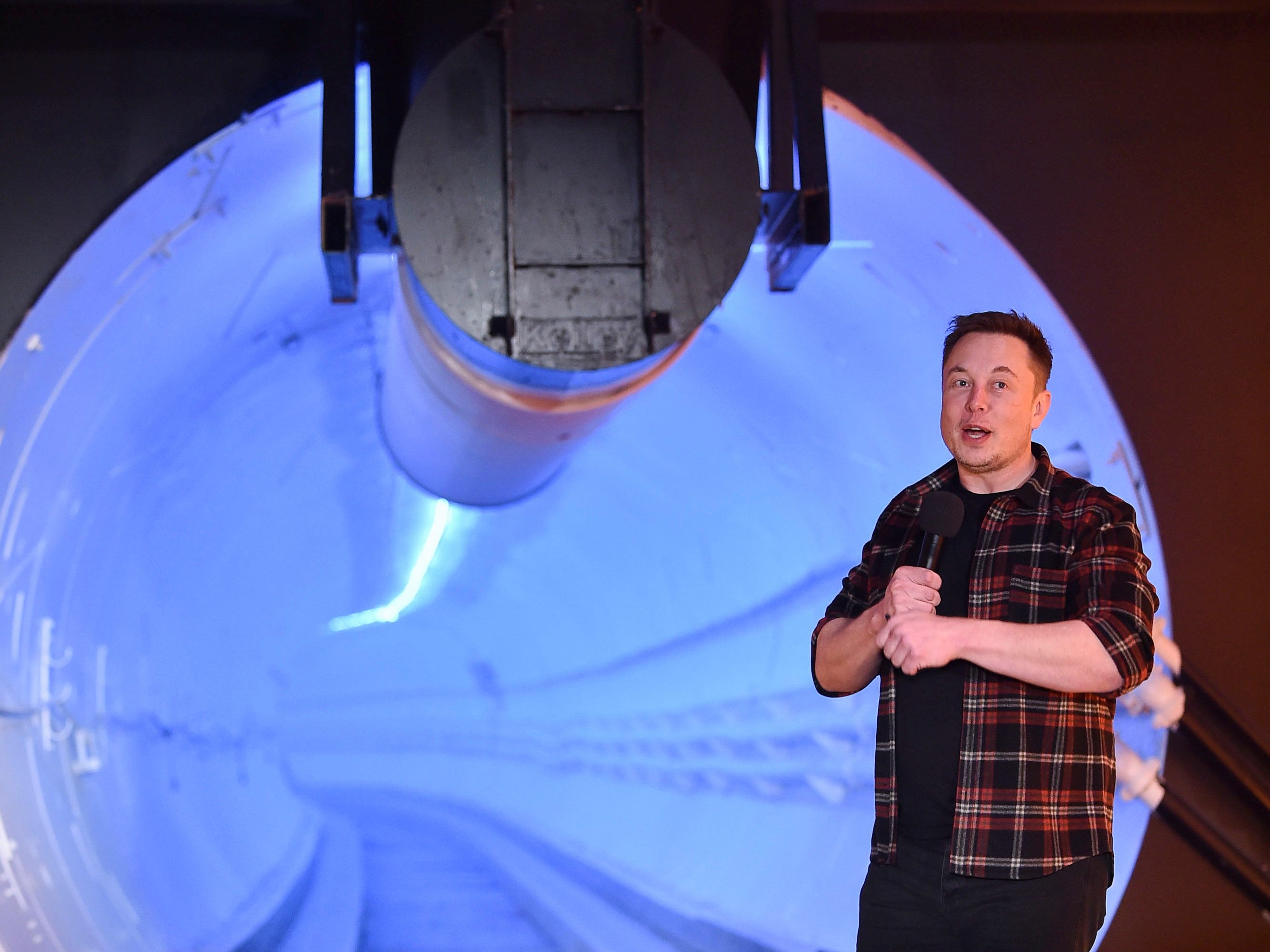 Elon Musk stands by a test tunnel dug by The Boring Company in Hawthorne, California