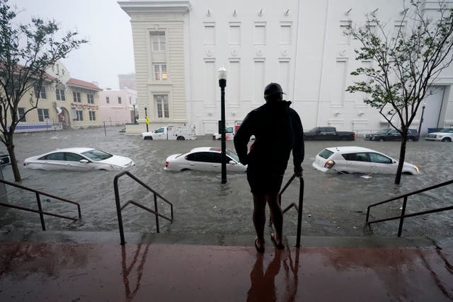 Flood waters move up a street in downtown Pensacola, Florida after Hurricane Sally made landfall on Wednesday 