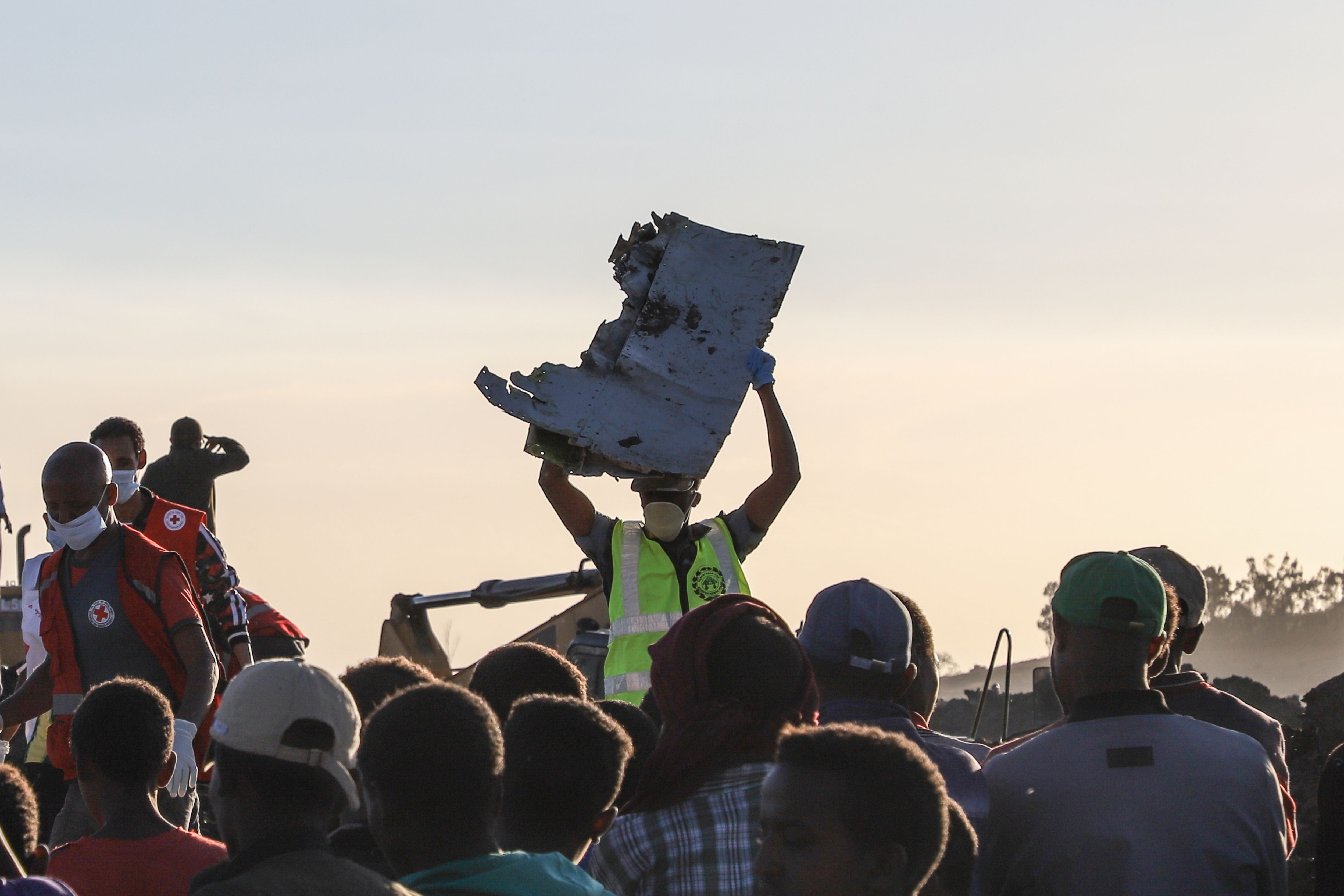 Rescuers scour through the rubble of a crashed jet in Ethiopia in an attempt to find survivors