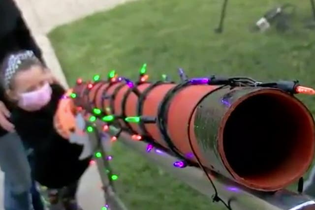 Man creates candy chute so children can trick-or-treat amid pandemic 