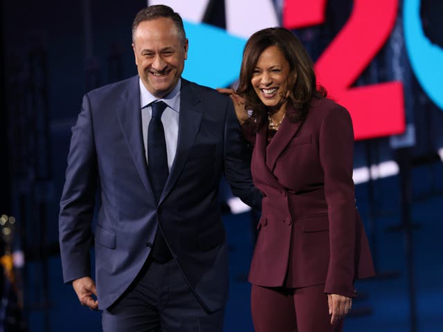 Democratic vice presidential nominee Kamala Harris and her husband Douglas Emhoff appear on stage after Harris delivered her acceptance speech on the third night of the Democratic National Convention from the Chase Centre on 19 August 2020 in Wilmington, Delaware