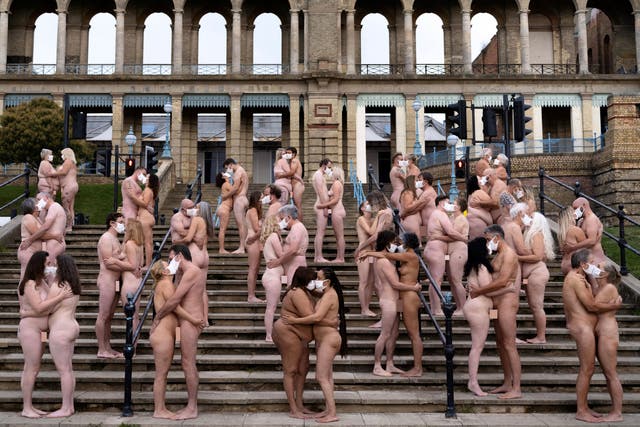 Volunteers strip down - except for masks - at Alexandra Palace