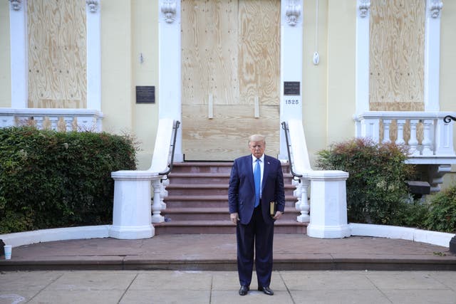 Donald Trump poses outside a church in Lafayette Square after it was cleared of protesters