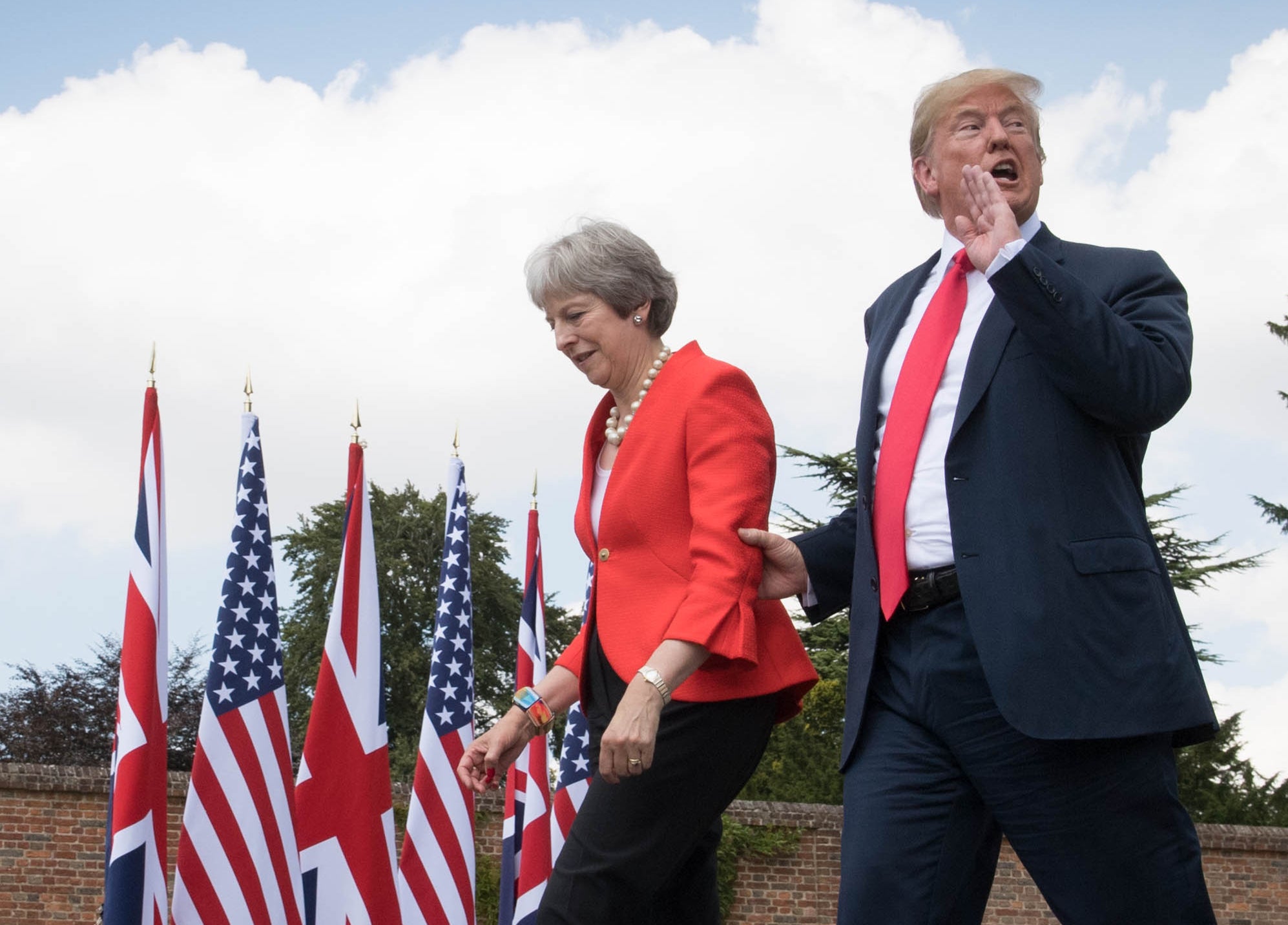 May and the US president make their way to a joint press conference at Chequers in 2018