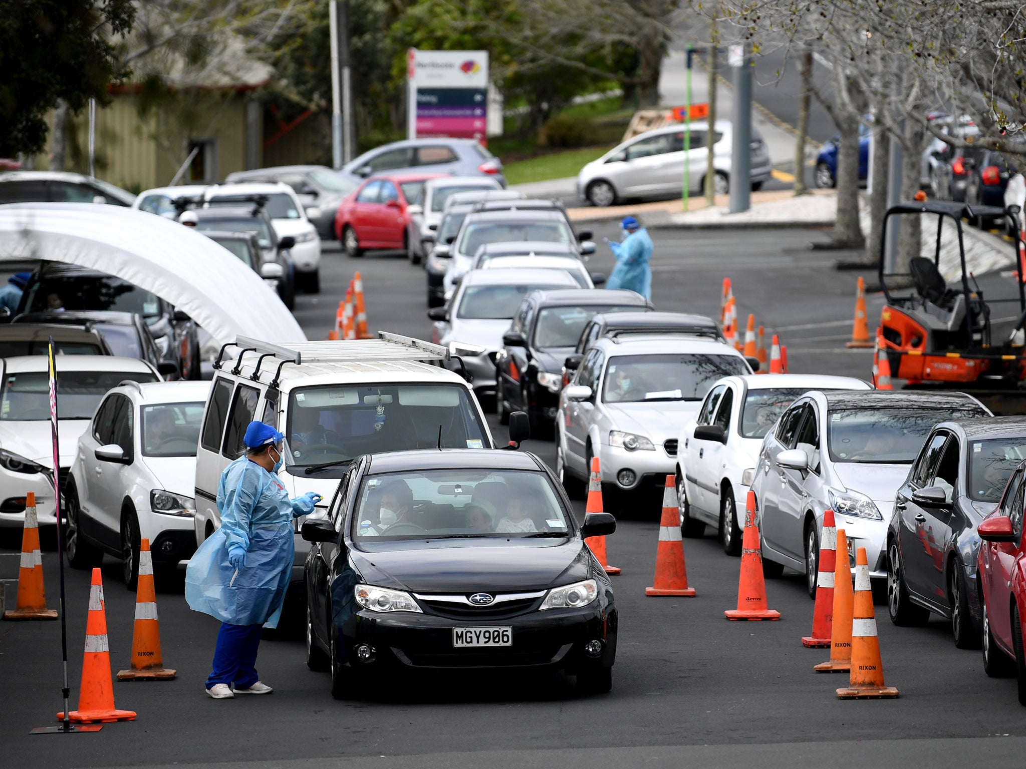 People wait to get a Covid-19 test at the Northcote Covid-19 testing facility in Auckland on September 14 as the city remains on Alert Level 2.5