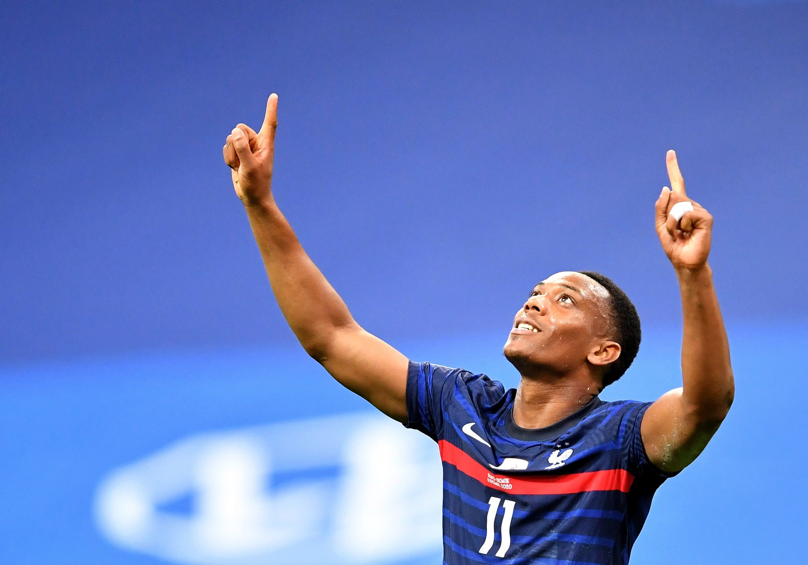 Anthony Martial celebrates scoring for France