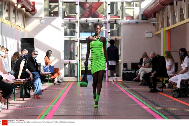 A model walks the runway in the Mark Fast SS21 show at Hackney Depot, on Friday 18 September