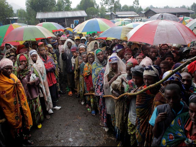 People in Kibati, eastern Congo, wait for World Food Programme supplies to be distributed in 2012