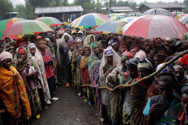 People in Kibati, eastern Congo, wait for World Food Programme supplies to be distributed in 2012