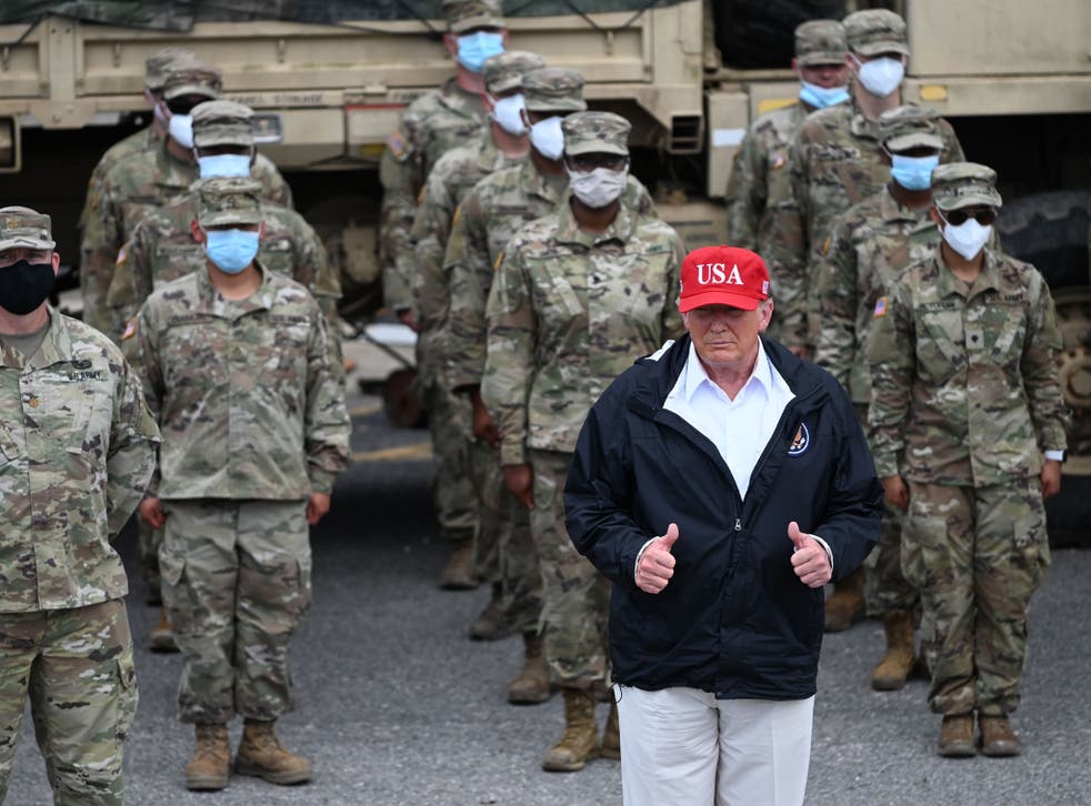 Donald Trump with National Guard troops in Lake Charles, Louisiana, on August 29, 2020 after Hurricane Laura tore through the area 