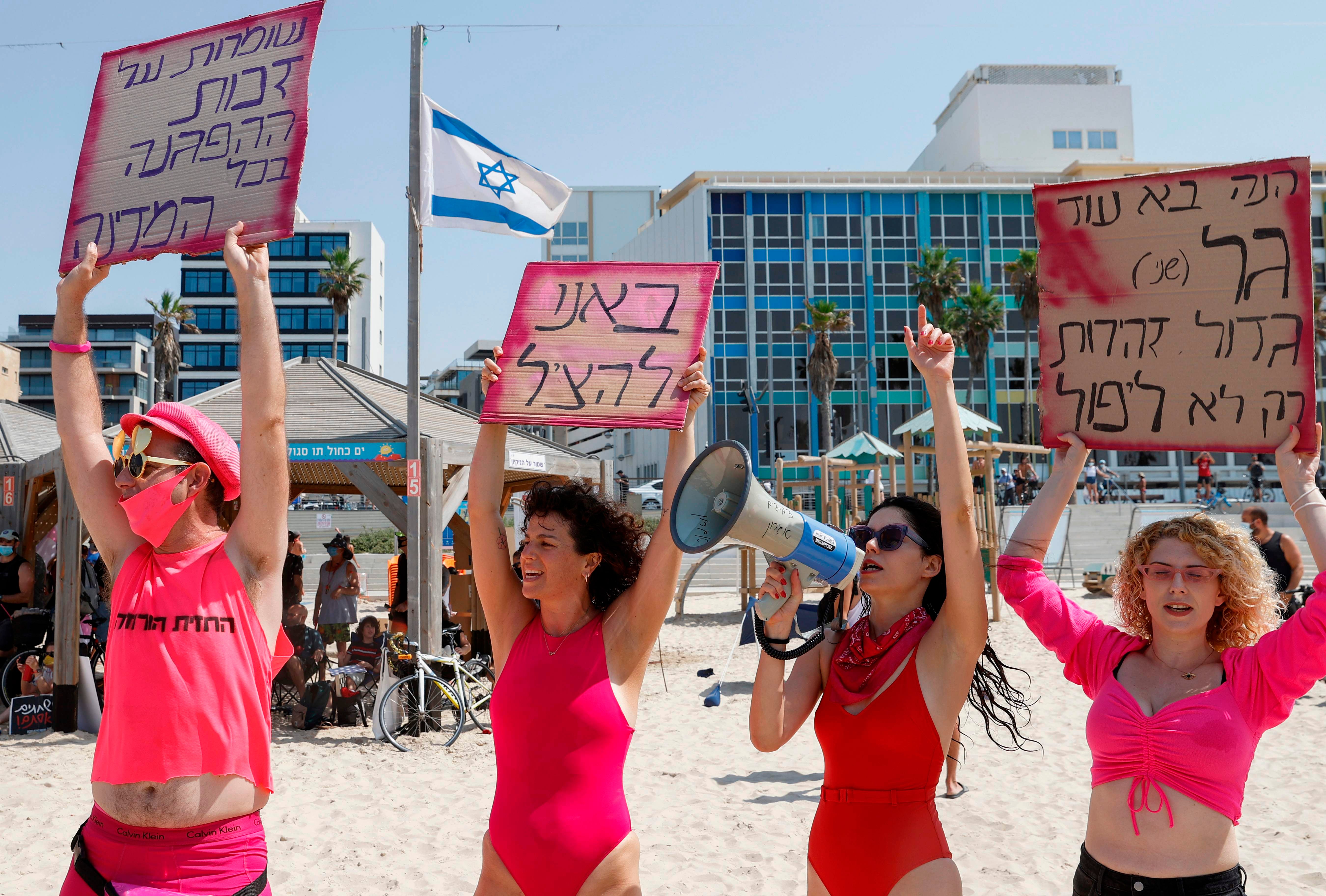 Israelis demonstrate in the Israeli coastal city of Tel Aviv to protest against the government's decision to close beaches during the lockdown