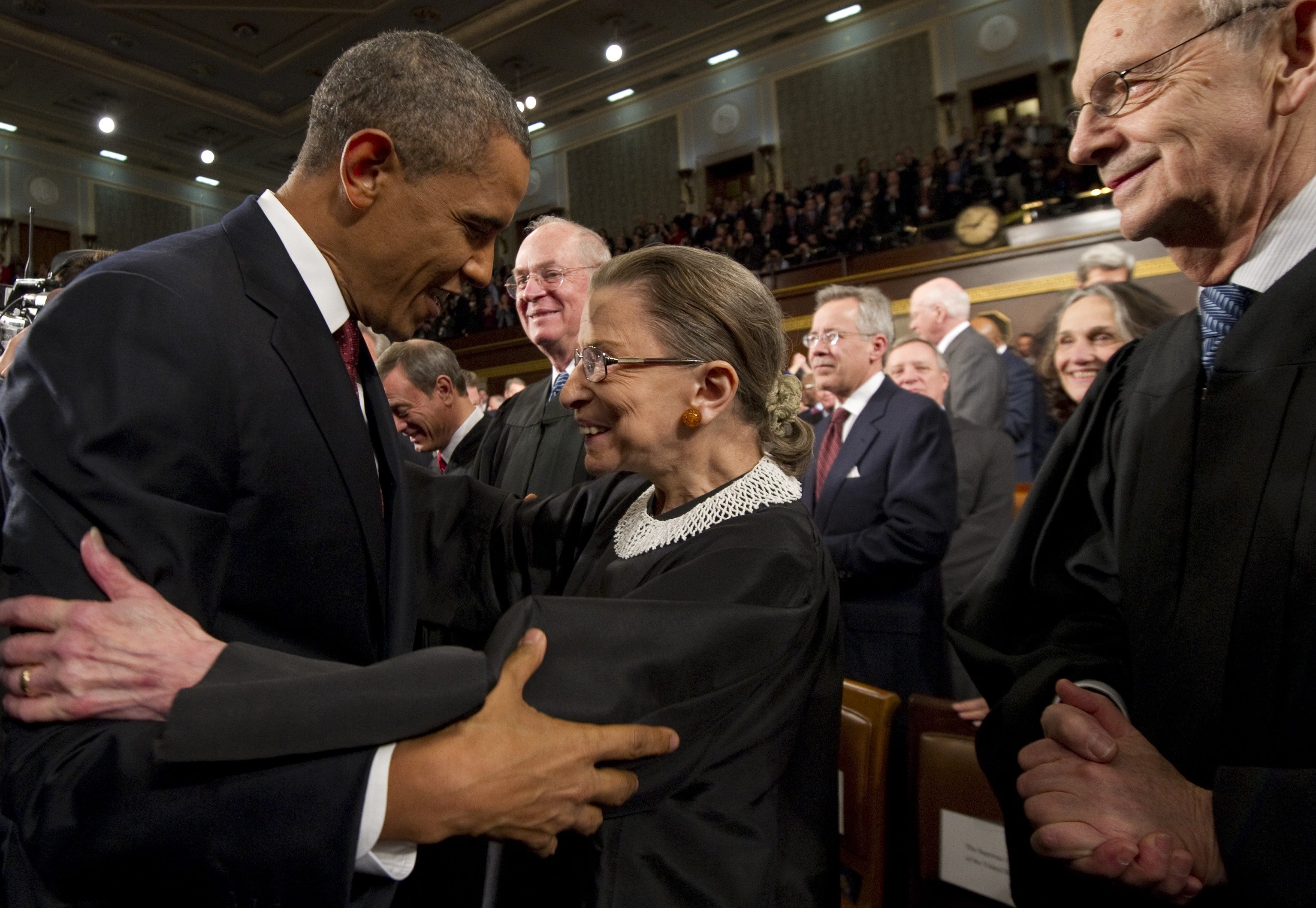 President Barack Obama greets Supreme Court Justice Ruth Bader Ginsburg before his State of the Union address in 2012