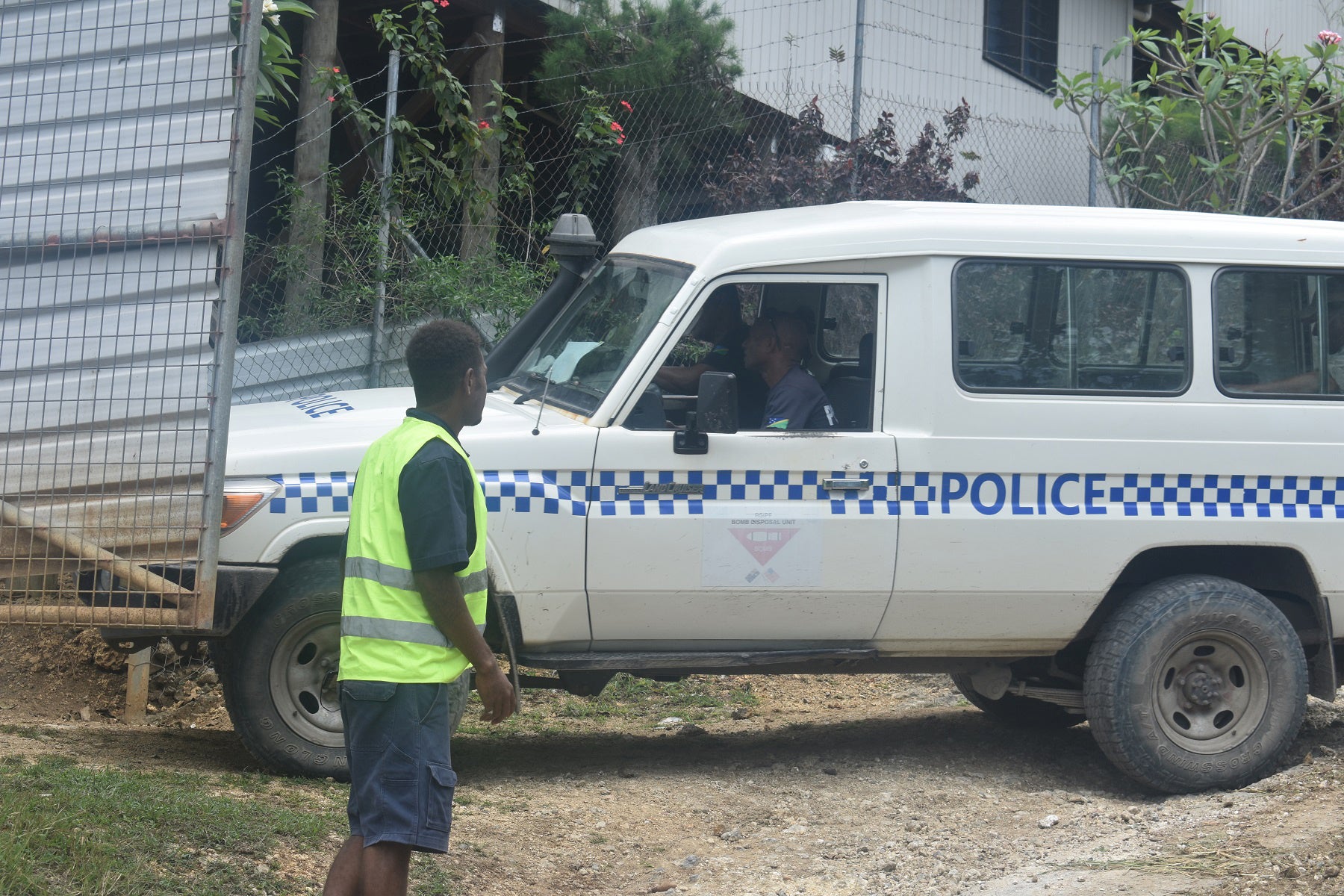 A police vehicle arrives at the scene of Sunday’s blast in Tasahe, a neighbourhood in West Honiara, Solomon Islands