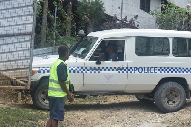 A police vehicle arrives at the scene of Sunday’s blast in Tasahe, a neighbourhood in West Honiara, Solomon Islands