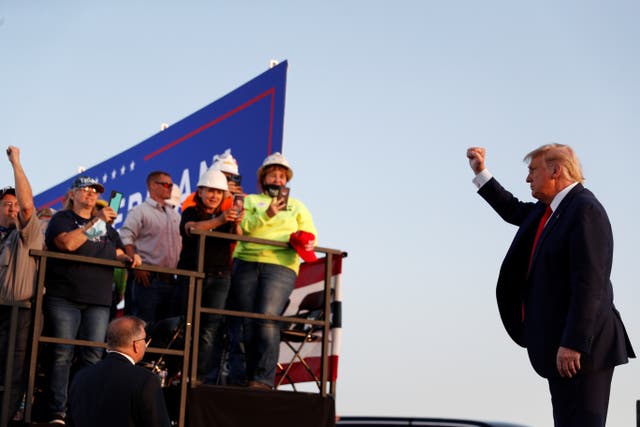 Donald Trump greets supporters while campaigning in Ohio on 21 September.