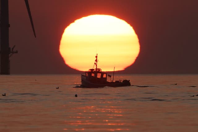A fishing boat sails off the coast of Britain