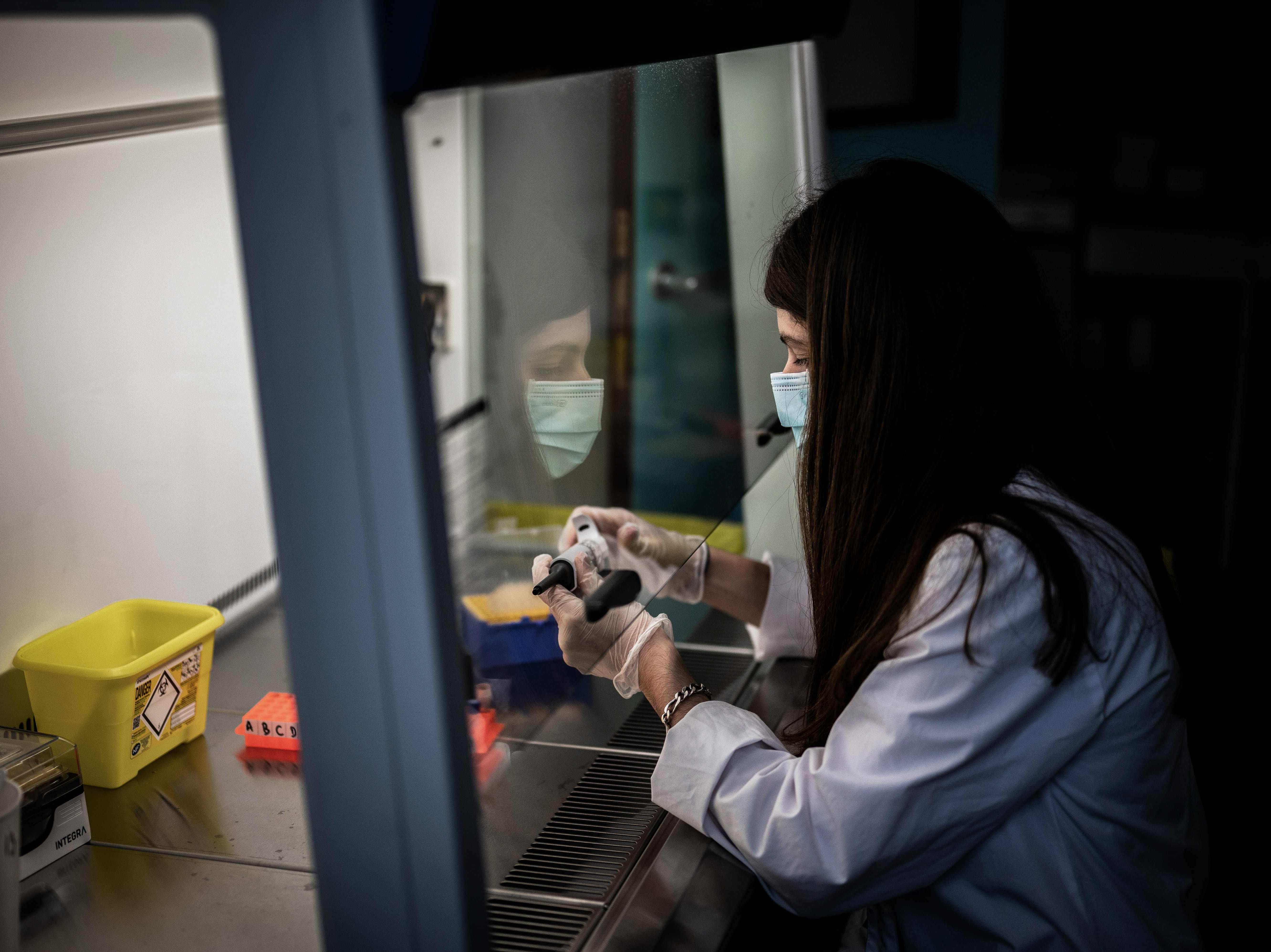 A medical assistant prepares a sample from a patient for a coronavirus (Covid-19) test at an analysis laboratory in Le Peage-de-Roussillon