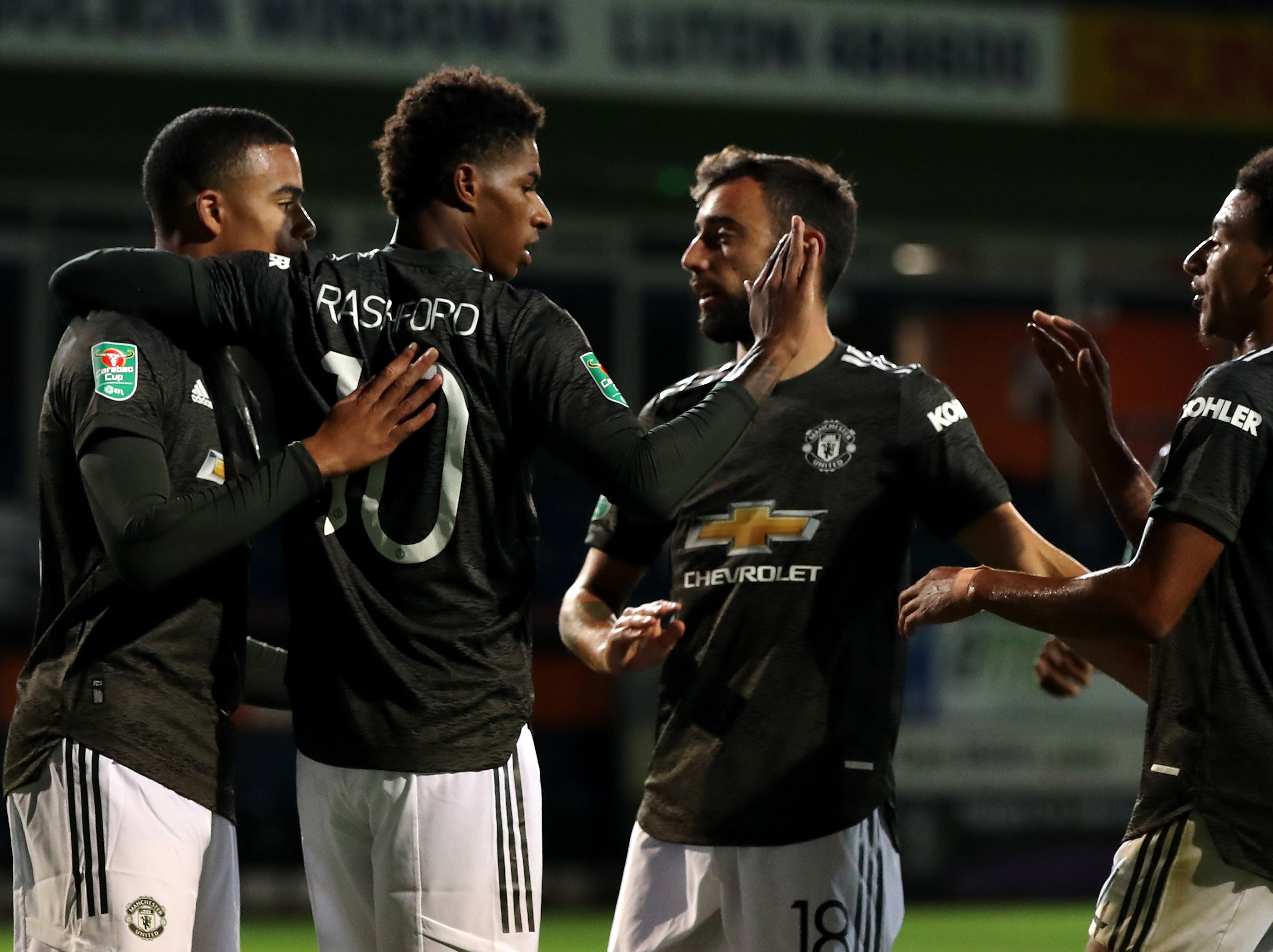 Marcus Rashford celebrates his late goal at Kenilworth Road