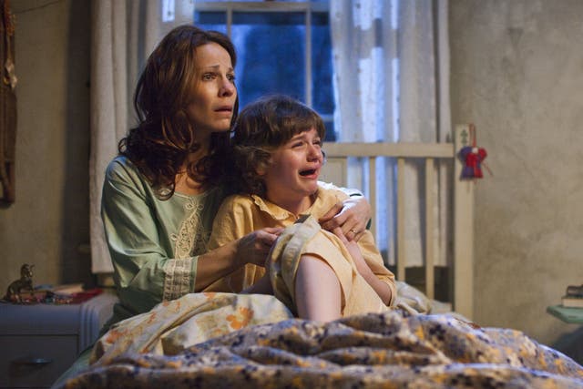 Lili Taylor and Joey King in the 2013 horror movie 'The Conjuring'