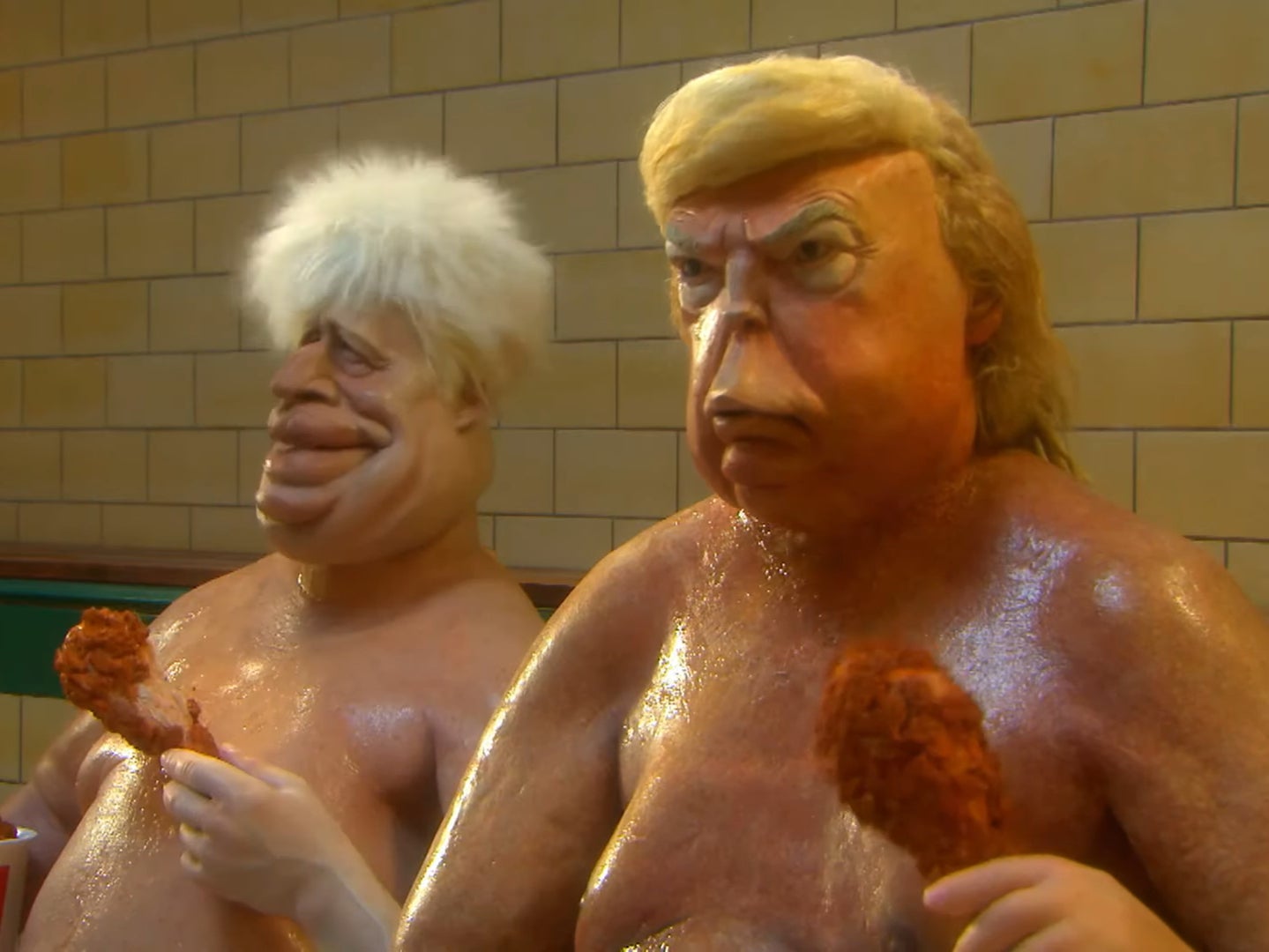 Puppets representing Donald Trump and Boris Johnson are depicted eating fried chicken in a sauna