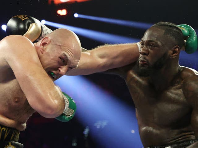 Deontay Wilder punches Tyson Fury