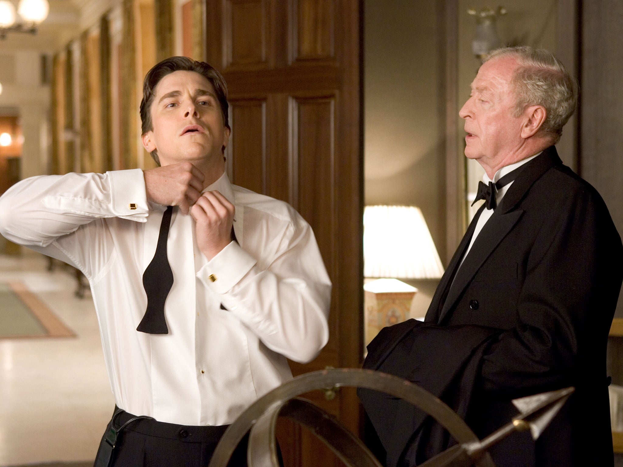 Christian Bale as Bruce Wayne, AKA Batman, and Michael Caine as Alfred in the Christopher Nolan series