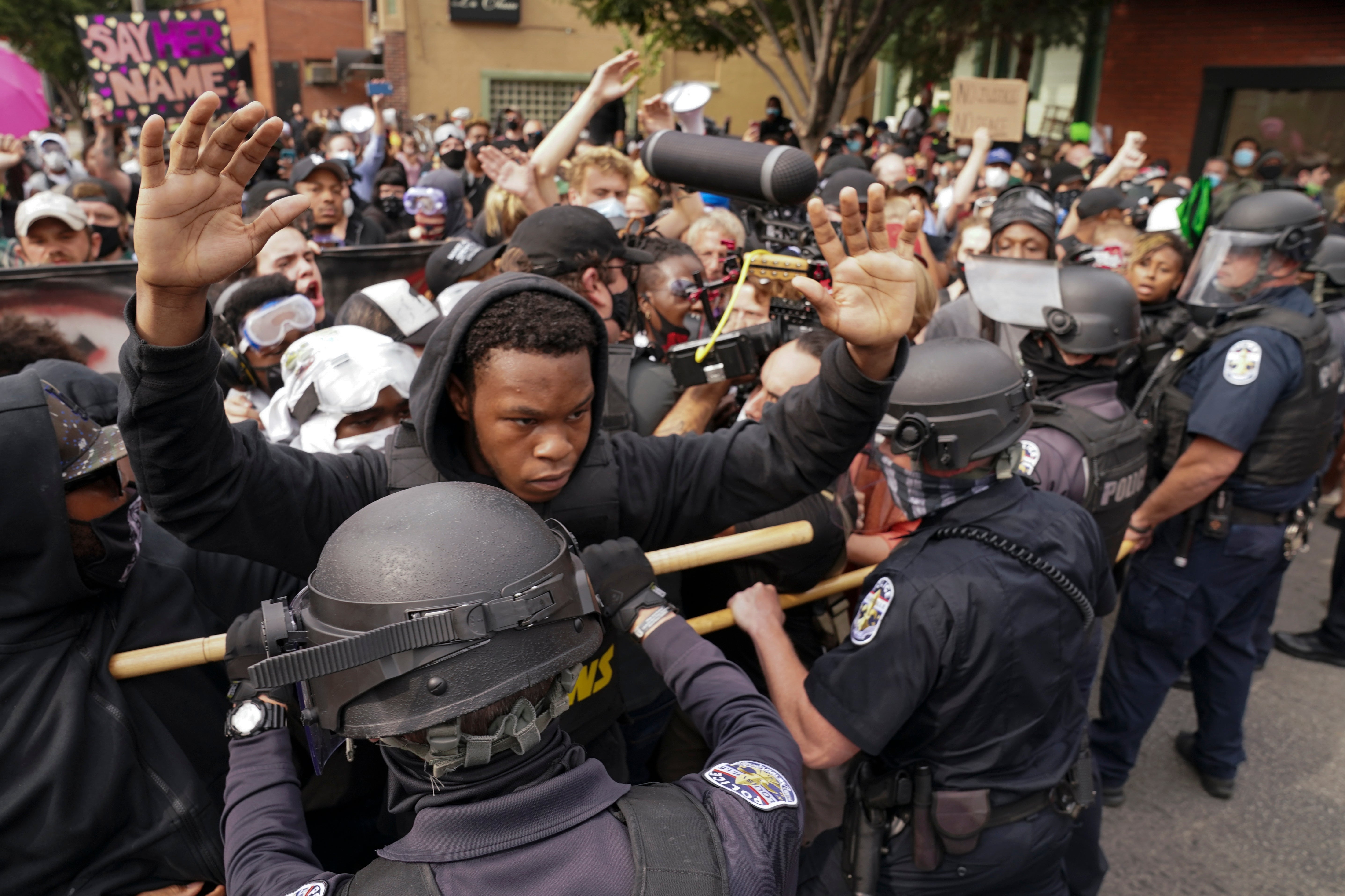 Angry clashes between police and protesters broke out in Louisville on Wednesday night