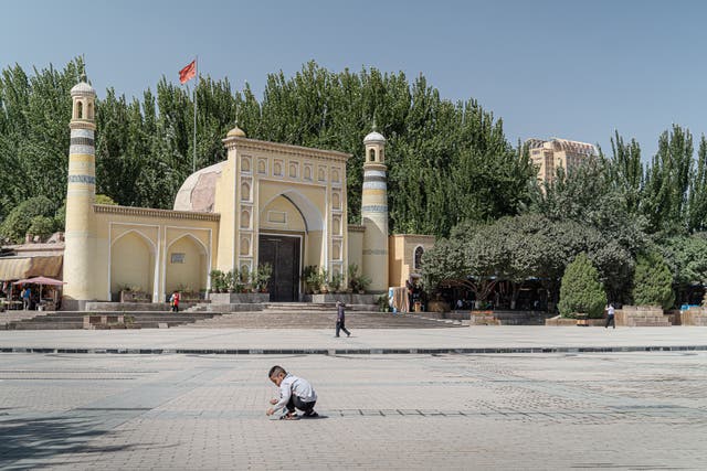 The Chinese flag hoisted above the famous Id Kah mosque in Kashgar stands taller than the crescents and minarets