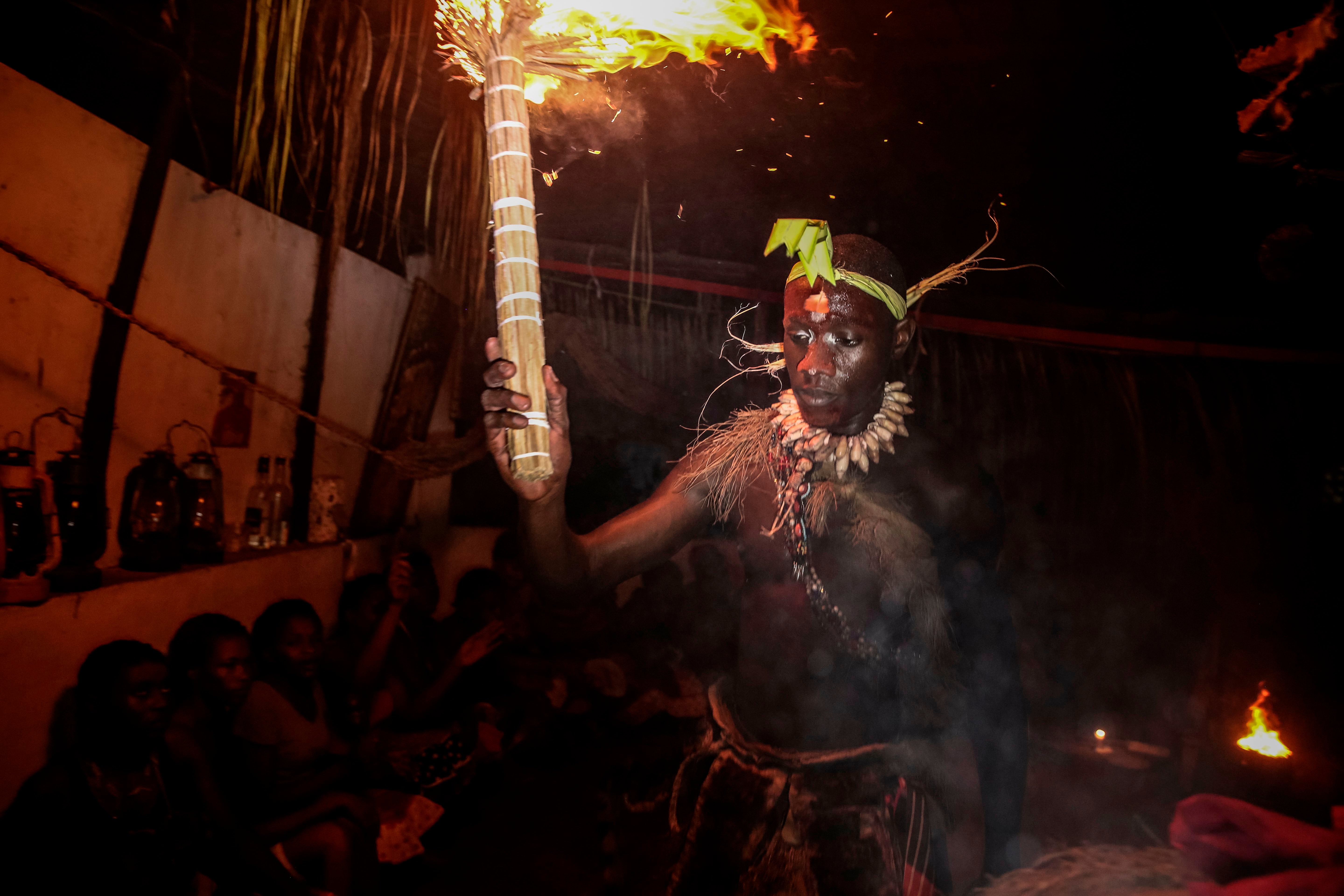 An initiate of the Bwiti rite dances during a ceremony after having used the iboga plant in Libreville. Iboga, extract from a plant known for its hallucinogenic powers, used in the Gabonese traditional rite, is also used to cure addictions to drugs, alcool or tobacco
