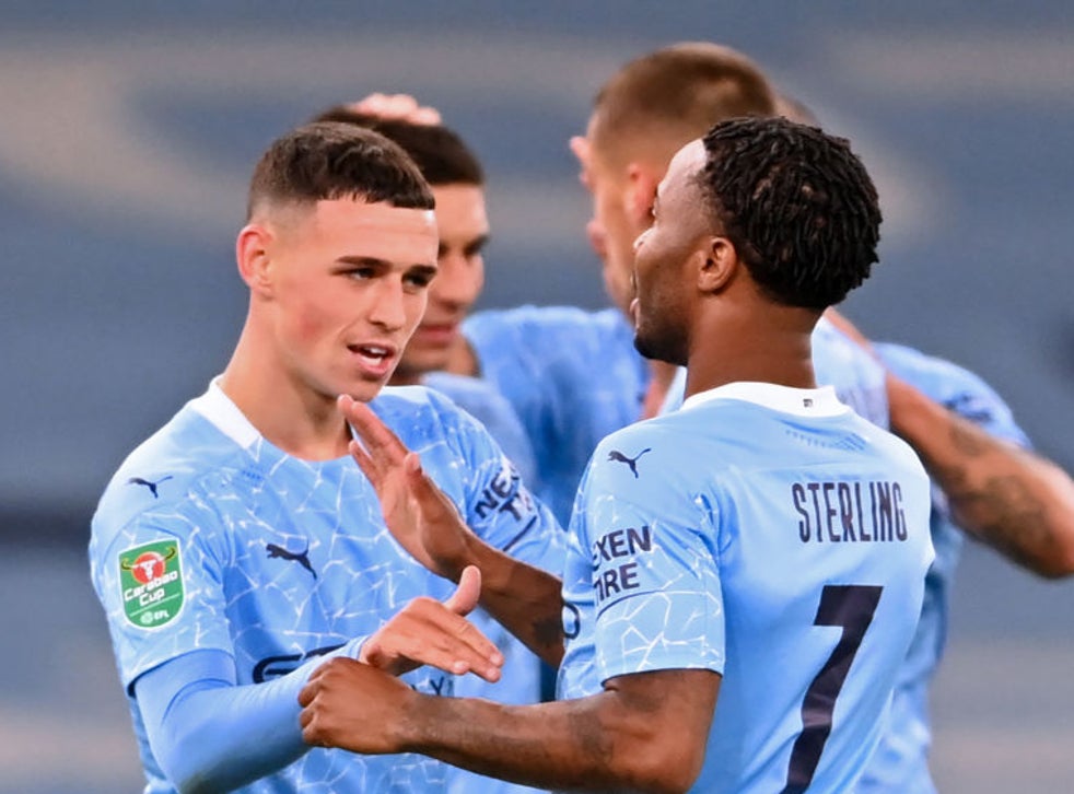 Phil Foden celebrates with teammates after scoring