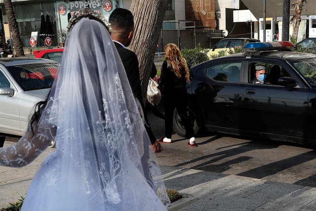 Virus Outbreak Mideast Wedding Busters