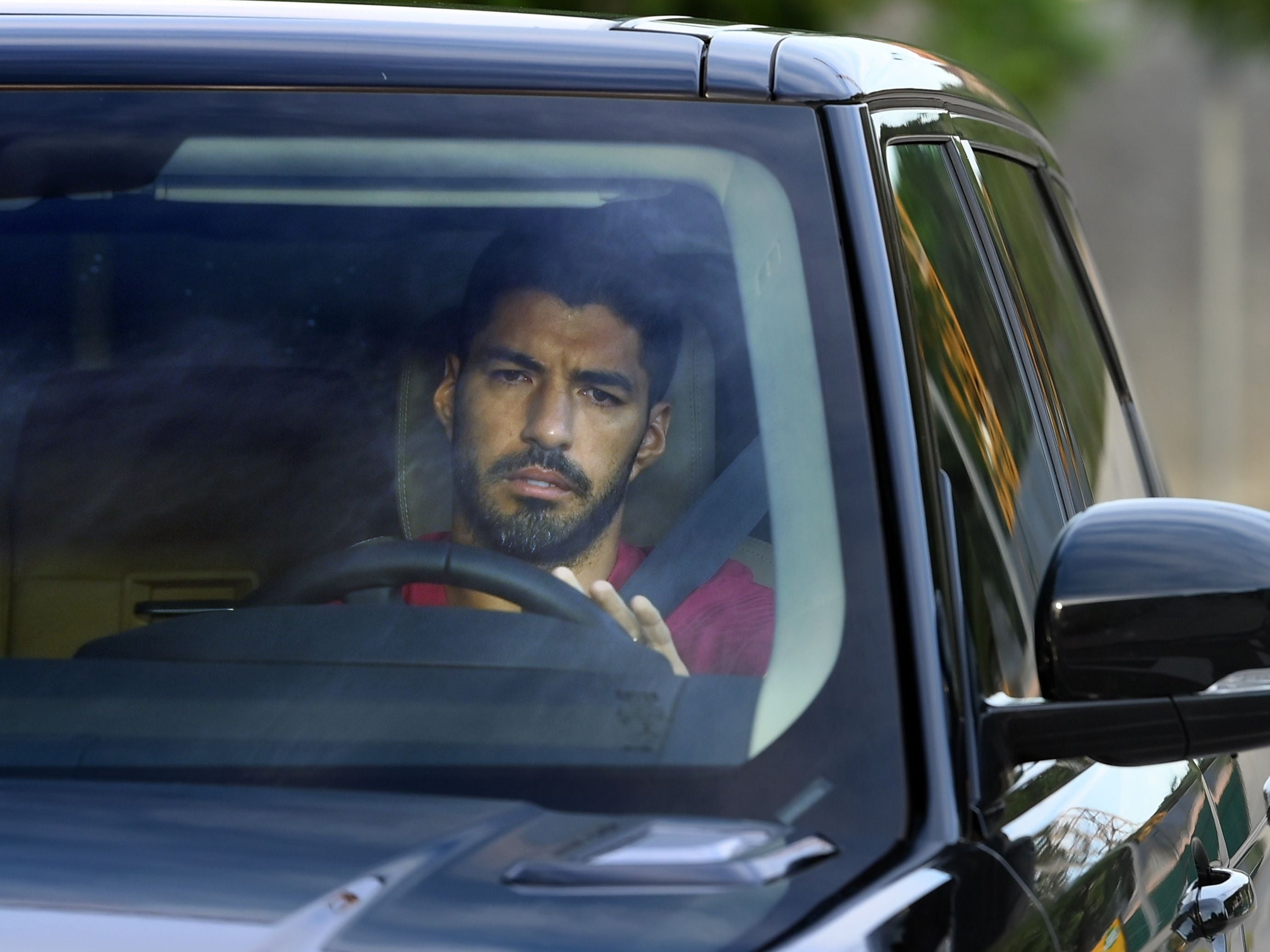 Luis Suarez arrives for one of his final training sessions