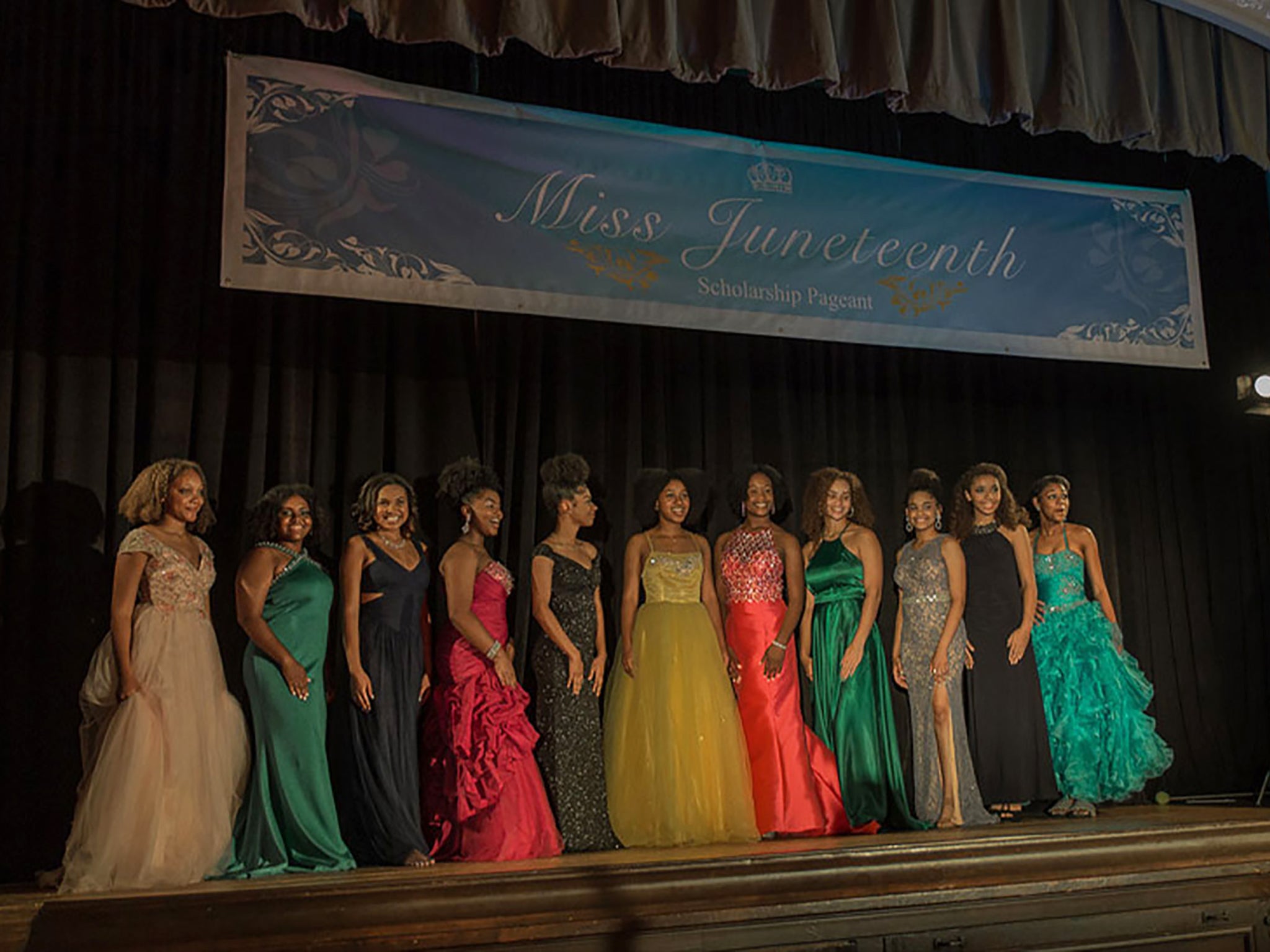 Alexis Chikaeze, centre, takes her place at the Miss Juneteenth pageant