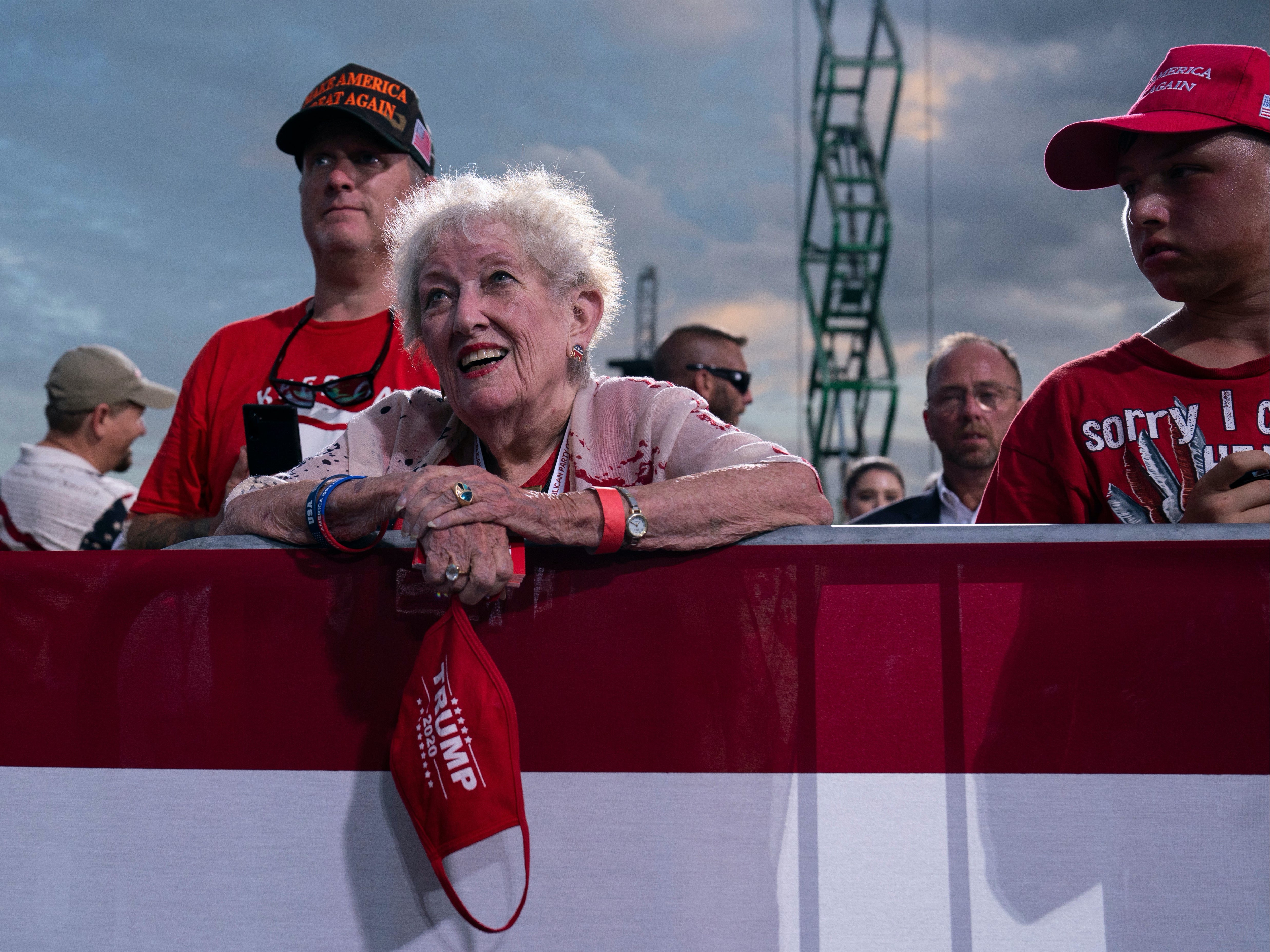 Supporters of President Trump listen as he speaks at a campaign rally in Jacksonville on Thursday night.