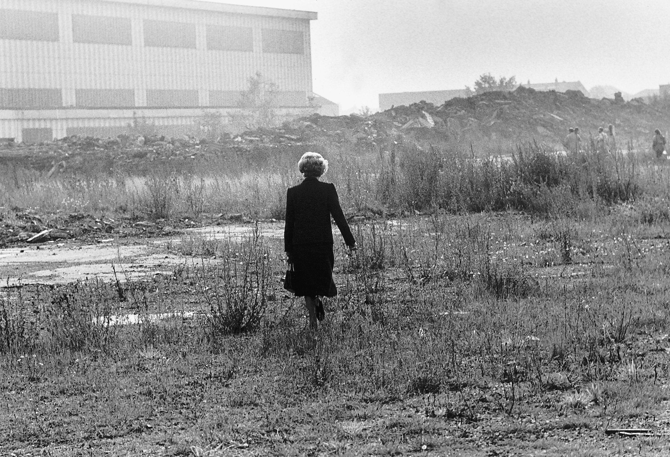 Margaret Thatcher walking through waste ground in Teesside During the 1980's