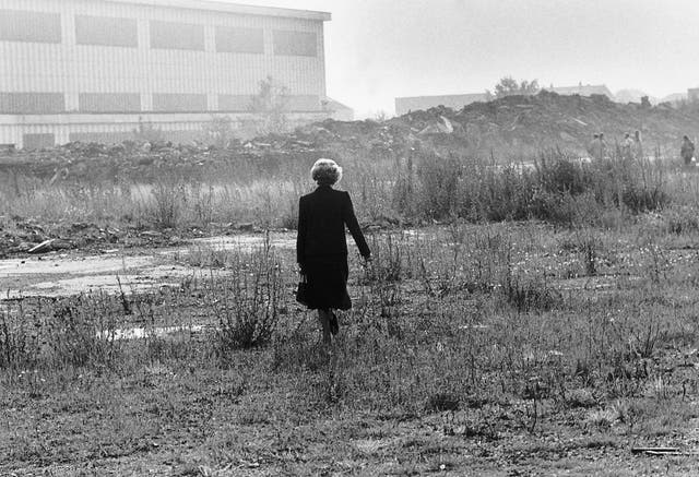 Margaret Thatcher walking through waste ground in Teesside During the 1980's