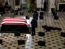 Ruth Bader Ginsburg's personal trainer does push-ups in front of her casket in US Capitol