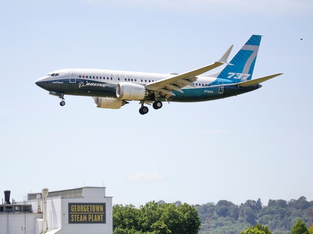A Boeing 737 MAX jet lands following an FAA test flight at Boeing Field in Seattle, Washington, in June