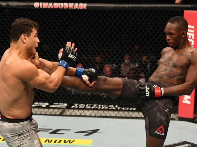 Israel Adesanya (right) put on a masterclass against challenger Paulo Costa