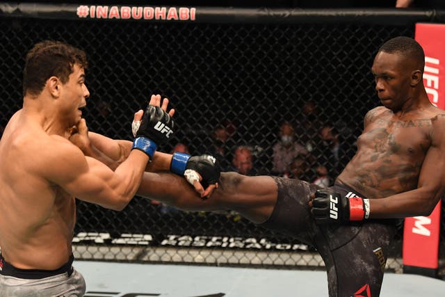 Israel Adesanya (right) put on a masterclass against challenger Paulo Costa
