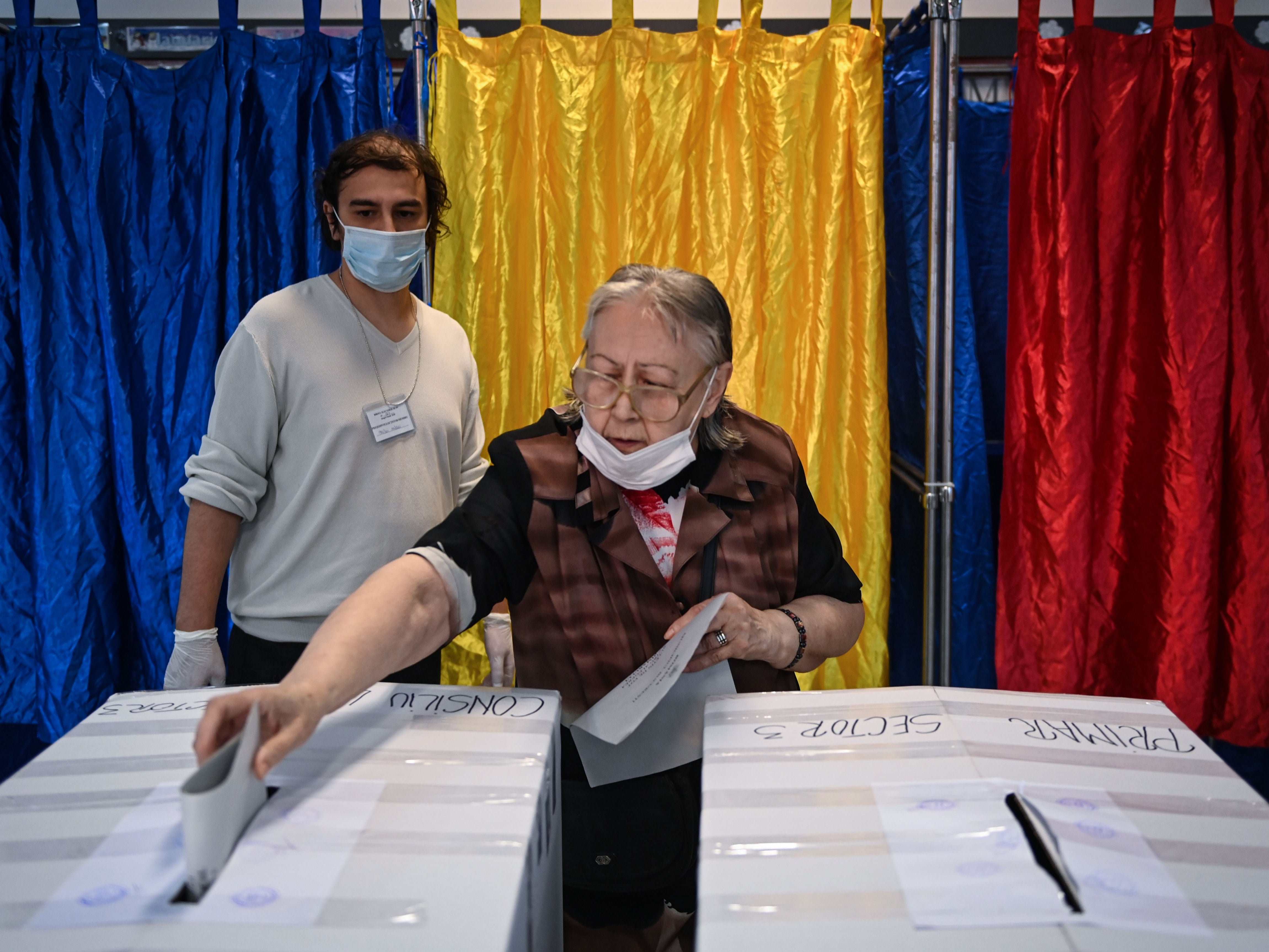 A voter casts a ballot at a polling station in Bucharest on Sunday