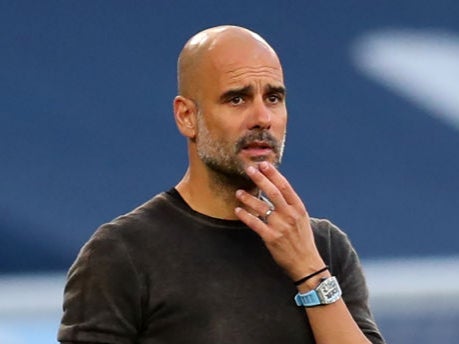 Pep Guardiola gestures on the touchline