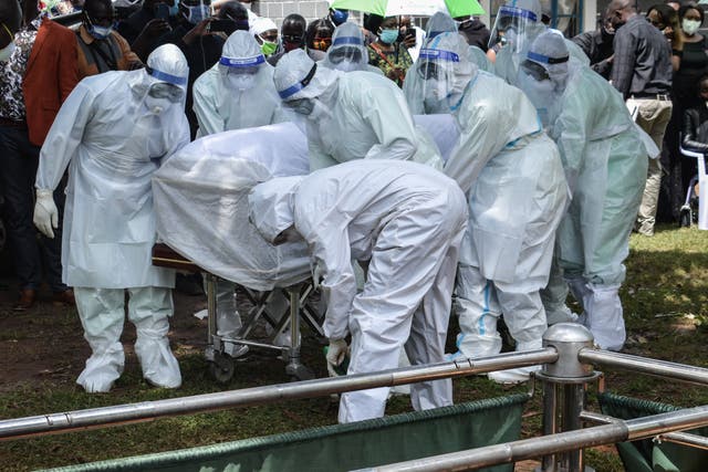 Medics carry the coffin of Dr Lugaliki – the first doctor in Kenya to die from Covid-19 – in July