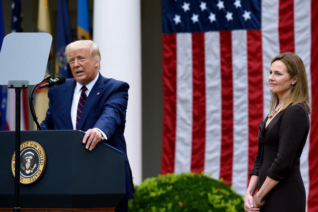 US President Donald Trump speaks next to Judge Amy Coney Barrett at the Rose Garden of the White House on September 26, 2020
