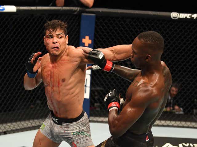 Israel Adesanya (right) retained his middleweight title by finishing Paulo Costa