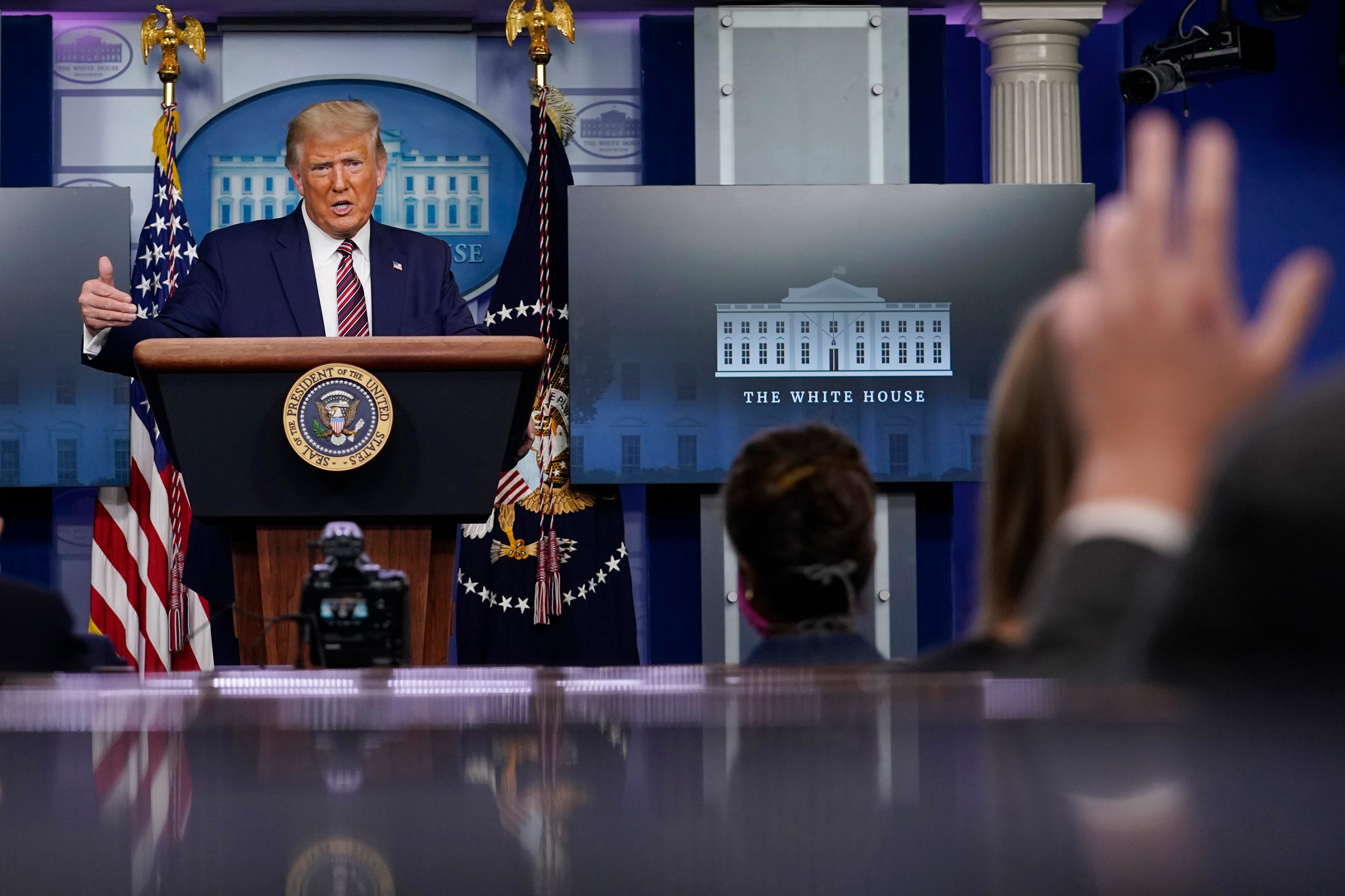 President Trump answers questions during a Sunday press conference at the White House.