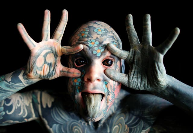 Mr Sylvain, alias Freaky Hoody, a primary school teacher and France's "most tattooed man", poses with his eyes full of black ink at Palaiseau, southern Paris, France